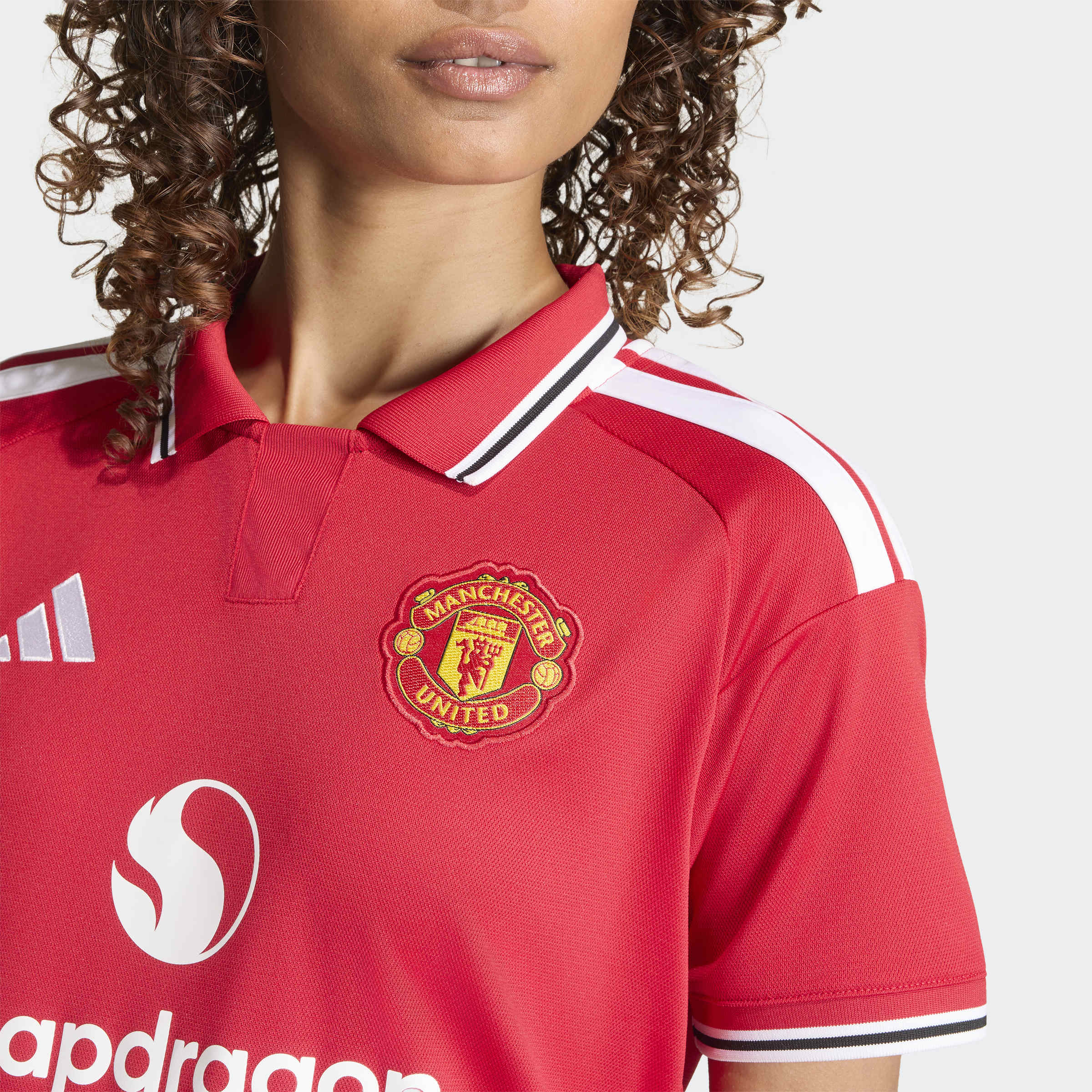 manchester united 2026/27 home shirt, red and white, front view close up